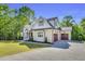 Expansive two-story home with attached garage and lush lawn, perfect for Gathering living at 669 Balmoral St, Clayton, NC 27520