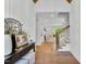 Elegant foyer with hardwood floors, paneled walls, staircase, and a view into the home's spacious living area at 669 Balmoral St, Clayton, NC 27520