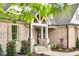 Charming porch features stone accents, white columns, and a cozy seating area at 669 Balmoral St, Clayton, NC 27520