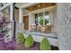 Cozy front porch features brick accents, wood columns, and charming rocking chairs at 669 Balmoral St, Clayton, NC 27520