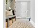Inviting hallway with a bench, storage baskets, and stylish herringbone brick flooring at 669 Balmoral St, Clayton, NC 27520