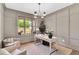 Stylish home office featuring a large window with natural light, neutral walls, and comfortable seating at 669 Balmoral St, Clayton, NC 27520