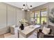 Cozy home office with a large window, hardwood flooring, and comfortable seating at 669 Balmoral St, Clayton, NC 27520
