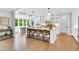 Kitchen island featuring pendant lighting, barstool seating, and a view to the bright breakfast nook at 669 Balmoral St, Clayton, NC 27520