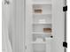 Linen closet with towels and decorative wicker baskets at 669 Balmoral St, Clayton, NC 27520