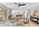 Open-concept living room showcasing stylish furnishings and seamless flow to kitchen and outdoor spaces at 669 Balmoral St, Clayton, NC 27520