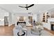 Spacious living room with hardwood floors, comfortable seating, and an open layout leading to the kitchen area at 669 Balmoral St, Clayton, NC 27520