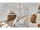 Well lit bedroom features hardwood floors, a chandelier, and custom dresser at 669 Balmoral St, Clayton, NC 27520