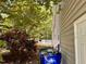 Landscaped backyard with vibrant flowers and white picket fence details at 6715 St Johns Ct, Raleigh, NC 27616