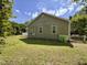 View of the yard featuring green grass and partial view of the house at 6715 St Johns Ct, Raleigh, NC 27616
