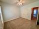 Bright bedroom with carpet, double closet and a ceiling fan at 6715 St Johns Ct, Raleigh, NC 27616