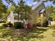 Charming home featuring a manicured lawn and mature trees at 6715 St Johns Ct, Raleigh, NC 27616