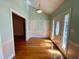 Bright and spacious foyer with hardwood floors, a modern light fixture, and convenient entryways at 6715 St Johns Ct, Raleigh, NC 27616