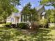 Beautifully landscaped home with a tidy front yard, and charming architectural design at 6715 St Johns Ct, Raleigh, NC 27616