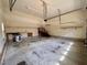 Spacious garage interior featuring concrete floors, and neutral wall paint at 6715 St Johns Ct, Raleigh, NC 27616