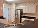 Well-equipped kitchen showcasing stainless steel refrigerator and ample countertop space at 6715 St Johns Ct, Raleigh, NC 27616
