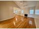 Open-concept layout showcasing living room fireplace and views of the dining area at 6715 St Johns Ct, Raleigh, NC 27616