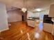 Open living and kitchen area with wood floors at 6715 St Johns Ct, Raleigh, NC 27616