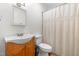 Simple bathroom with a white vanity and shower with curtain at 7313 Longstreet Dr, Raleigh, NC 27615