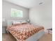 Minimalist bedroom with a large bed and bright natural light at 7313 Longstreet Dr, Raleigh, NC 27615