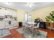 Kitchen featuring white appliances and a dining area filled with plants at 7313 Longstreet Dr, Raleigh, NC 27615