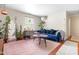 Cozy living room featuring a plush blue sofa and natural light at 7313 Longstreet Dr, Raleigh, NC 27615