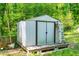 Backyard storage shed offers great space for organizing and storing lawn equipment at 7313 Longstreet Dr, Raleigh, NC 27615