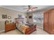 Charming bedroom with classic furniture, a ceiling fan, and natural light from the window at 733 Hadrian Dr, Garner, NC 27529