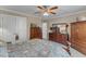 Inviting bedroom showcasing dressers, a ceiling fan, and a bed with patterned bedding at 733 Hadrian Dr, Garner, NC 27529