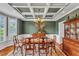 Traditional dining room boasting a coffered ceiling, wooden table, and elegant decor offers a stately feel at 733 Hadrian Dr, Garner, NC 27529