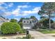 Charming home boasts an established yard and a driveway leading to the attached garage at 733 Hadrian Dr, Garner, NC 27529