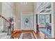 Bright foyer with hardwood floors, high ceilings, and elegant staircase welcomes guests at 733 Hadrian Dr, Garner, NC 27529