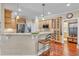 Contemporary kitchen features a breakfast bar, stainless steel appliances, and ample cabinet space for cooking at 733 Hadrian Dr, Garner, NC 27529