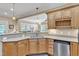 This kitchen features stainless appliances, granite countertops, and is adjacent to the breakfast nook at 733 Hadrian Dr, Garner, NC 27529