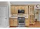 This kitchen features stainless appliances, a built-in microwave, and ample wood cabinet storage at 733 Hadrian Dr, Garner, NC 27529