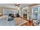 Serene living room featuring a fireplace, hardwood floors, and plush seating promotes relaxation and comfort at 733 Hadrian Dr, Garner, NC 27529