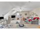 Spacious living room with sloped ceilings, comfortable seating, and an entertainment area at 733 Hadrian Dr, Garner, NC 27529