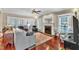 Sunlit living room offers hardwood floors, a cozy fireplace, neutral tones, and comfortable furnishings at 733 Hadrian Dr, Garner, NC 27529