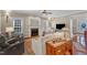 Bright living room features a fireplace, hardwood floors, and comfortable seating for a relaxing atmosphere at 733 Hadrian Dr, Garner, NC 27529