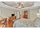 The main bedroom features wood floors, a ceiling fan, and classic furnishings at 733 Hadrian Dr, Garner, NC 27529