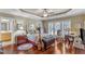 This main bedroom features a tray ceiling, hardwood floors and an adjacent ensuite at 733 Hadrian Dr, Garner, NC 27529