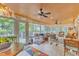 Charming sunroom boasts a wood ceiling, tile floors, and plenty of natural light at 733 Hadrian Dr, Garner, NC 27529