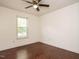 Well-lit bedroom with beautiful hardwood floors, ceiling fan and a large window with natural light at 81 Sallie Dr, Smithfield, NC 27577