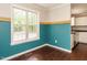 Bright breakfast nook featuring a large window and stylish teal accent wall, perfect for casual dining at 81 Sallie Dr, Smithfield, NC 27577