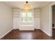 Bright dining room features wood floors, built-in shelving, a window seat, and a contemporary pendant light at 81 Sallie Dr, Smithfield, NC 27577