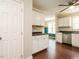 Features classic white cabinets, stainless steel appliances, and dark countertops, for a clean and timeless aesthetic at 81 Sallie Dr, Smithfield, NC 27577