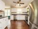 The kitchen offers white cabinets, stainless steel appliances, and wood floors, creating a welcoming space at 81 Sallie Dr, Smithfield, NC 27577