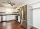 A well-appointed kitchen features modern stainless steel appliances, white cabinets, and a stylish ceiling fan at 81 Sallie Dr, Smithfield, NC 27577