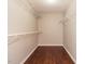 A practical walk-in closet with sturdy wire shelving and wood floors, providing organized storage at 81 Sallie Dr, Smithfield, NC 27577