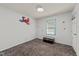 Bedroom with gray carpet, a trunk at the window, and Spider-Personal wall decals at 820 Nuttree Pl, Raleigh, NC 27606